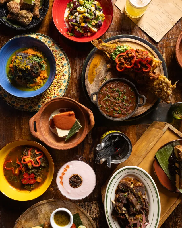 Clay pots and painted plates across the table at alaMar, Oakland