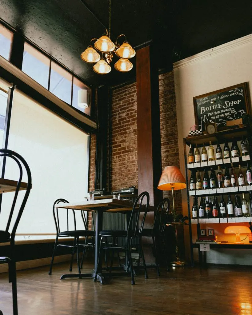 A corner table under the bottle wall at The Black Cat, Livermore