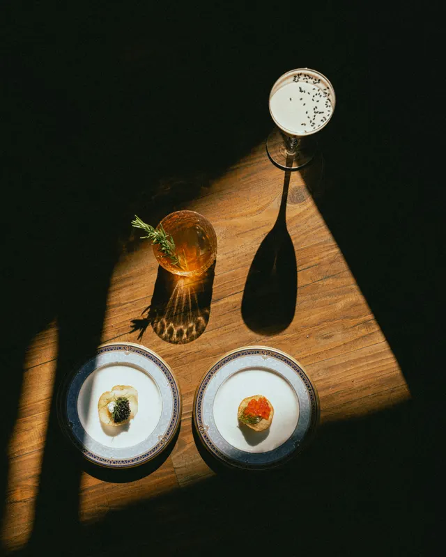 Hard afternoon shadows over small plates at The Black Cat, Livermore