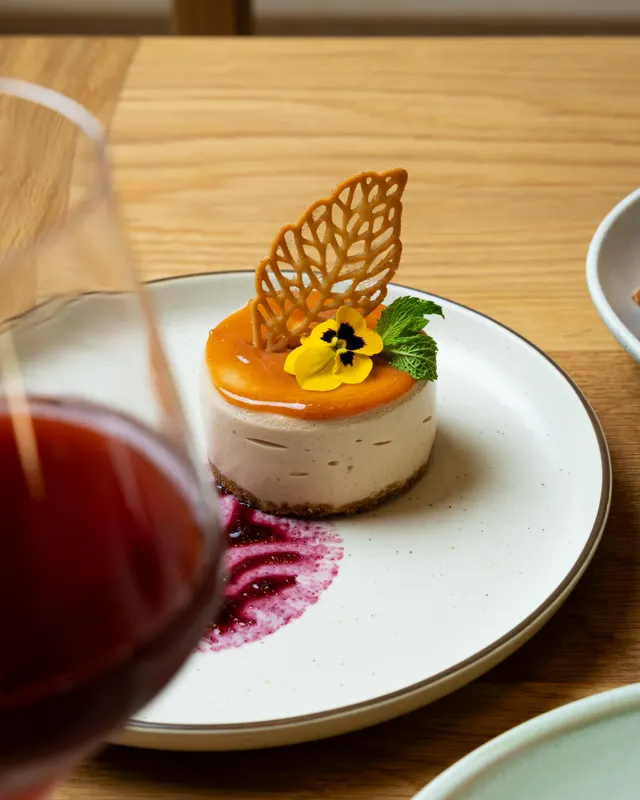 Passionfruit cheesecake with a lace tuile at Casa Sofia, San Francisco