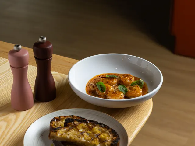 Lunch plates and pepper mills in the window light at Casa Sofia, San Francisco