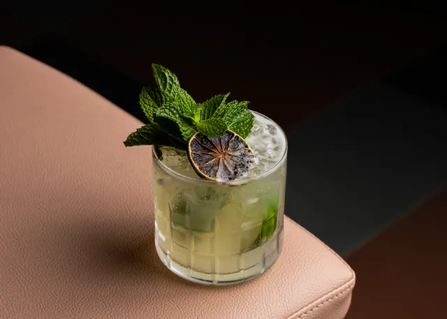 A dried-lime mojito on the banquette arm at Casa Sofia, San Francisco
