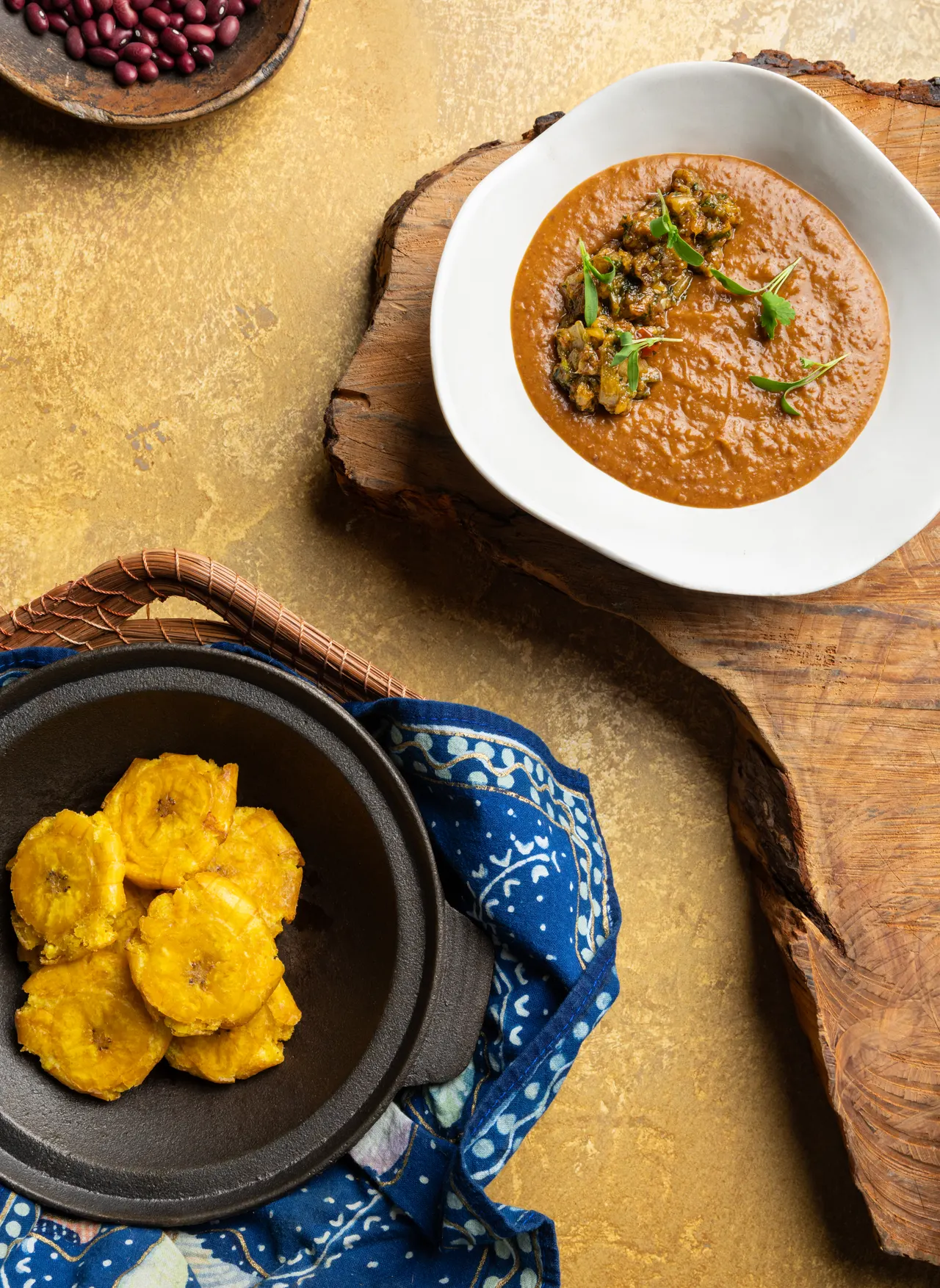 Sancocho and tostones plated to match, from Caribbean Cocktails for Ten Speed Press