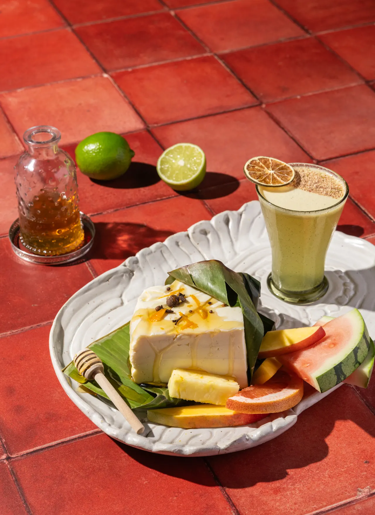 Tres leches and watermelon on terracotta, from Caribbean Cocktails for Ten Speed Press