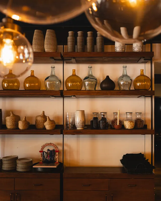 Amber glassware on the open shelves at Colibri, San Jose