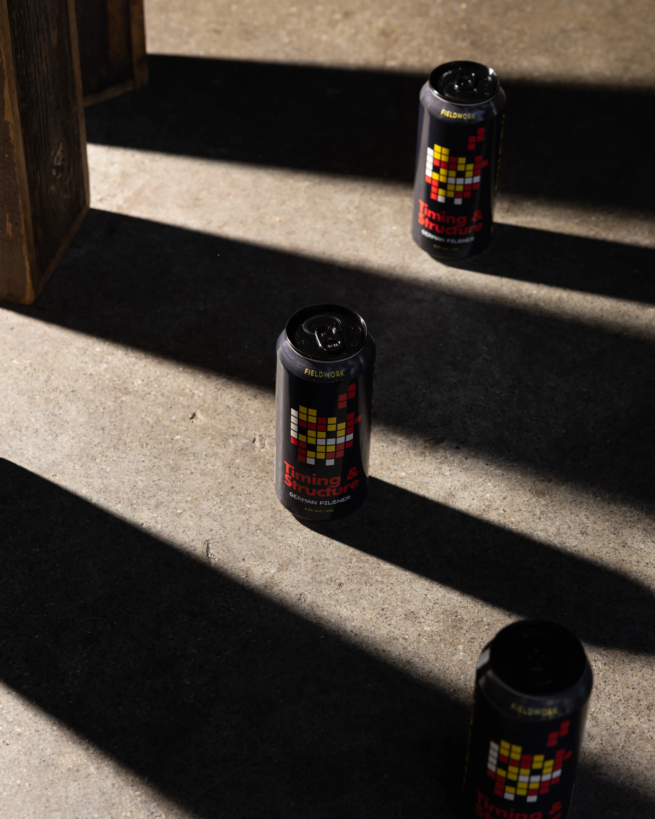 Cans in hard light and shadow for Fieldwork Brewing, San Leandro