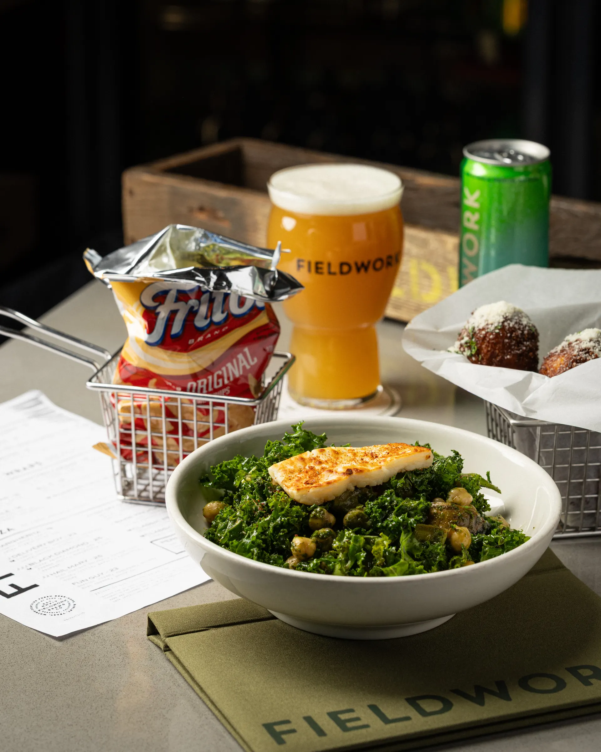 Beer and the taproom table spread for Fieldwork Brewing, San Leandro