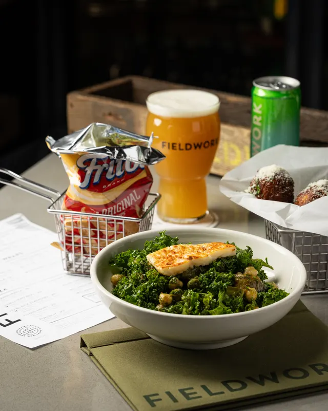 Beer and the taproom table spread for Fieldwork Brewing, San Leandro