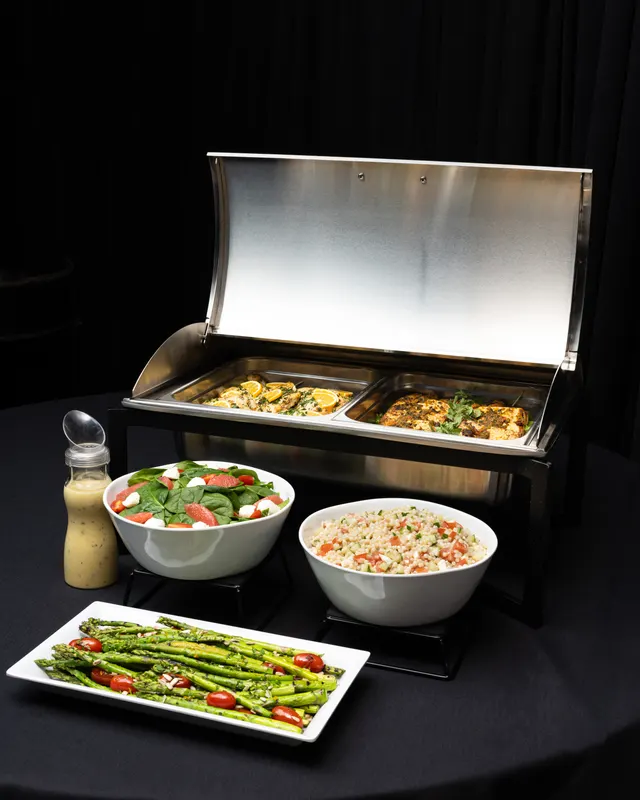 Chafing dishes and salads on the service line for Handheld Catering, Santa Clara