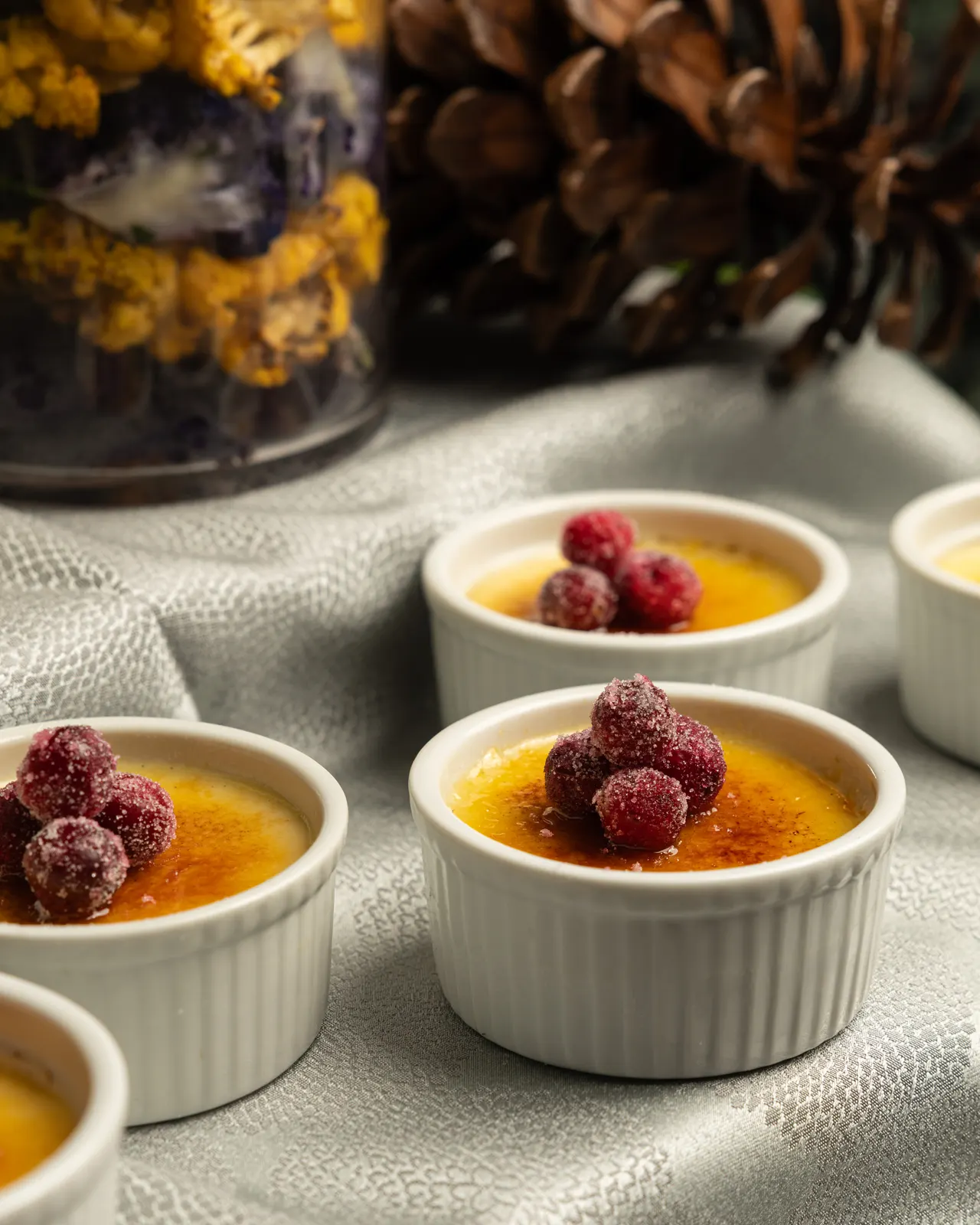 Creme brulee ramekins sugared and topped with cranberries for Handheld Catering, Santa Clara