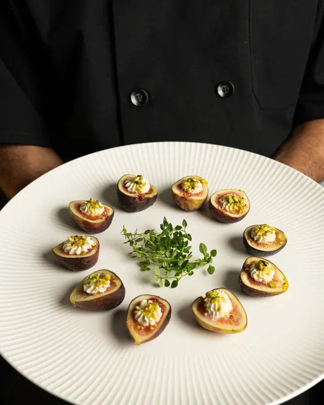 Stuffed figs plated in rounds for Handheld Catering, Santa Clara