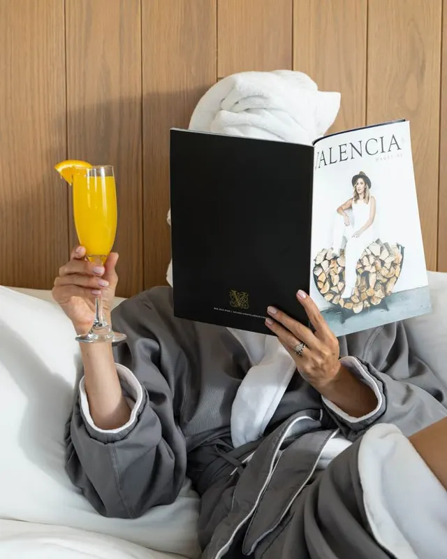 In-room brand shoot: robe, mimosa, and the house magazine at Hotel Valencia, San Jose