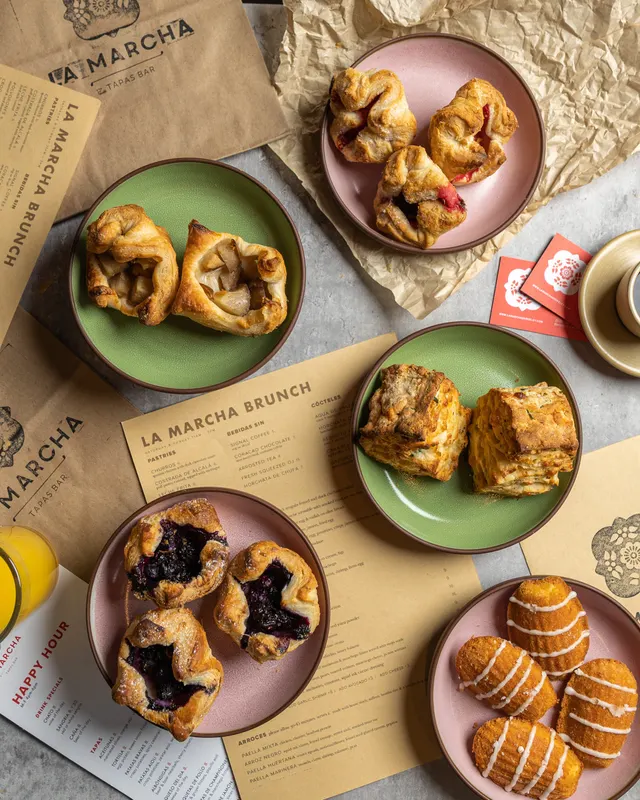 Brunch pastries flat-laid over the menus at La Marcha, Berkeley