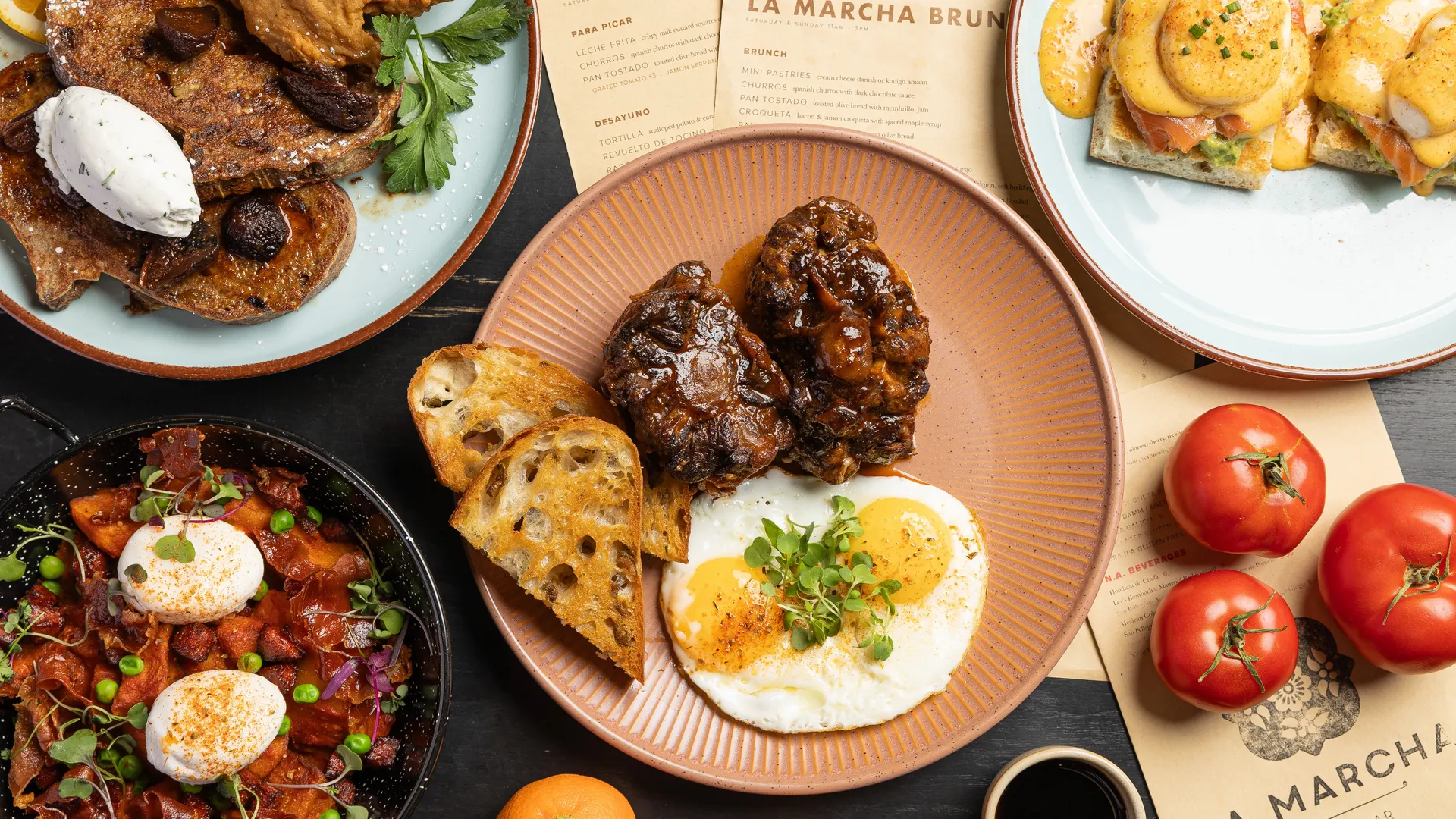 Brunch service from above at La Marcha, Berkeley: oxtail with fried eggs, toast, and the weekend menus