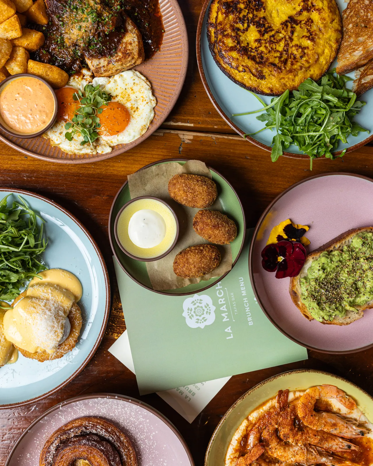 Brunch from above at La Marcha, Berkeley: tortilla, eggs, croquetas and gambas across the table
