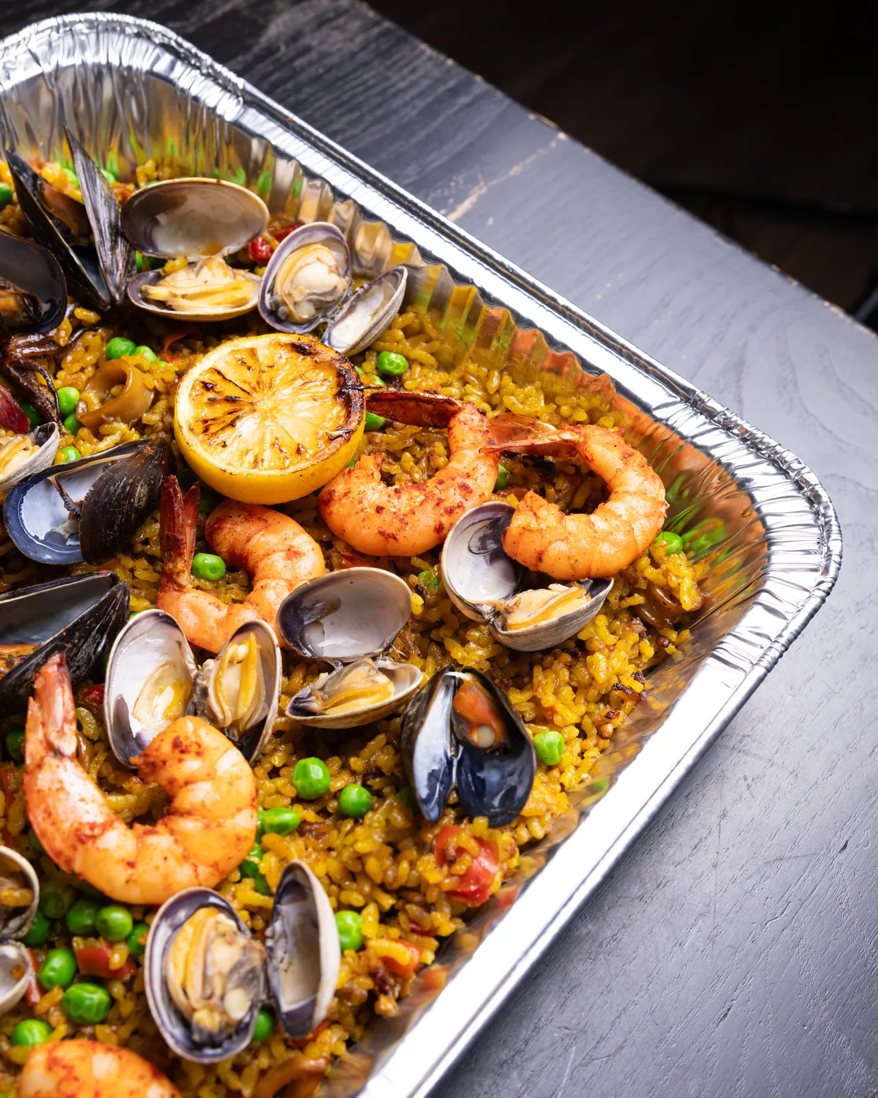 A catering tray of seafood paella with prawns, mussels and clams for La Marcha, Berkeley