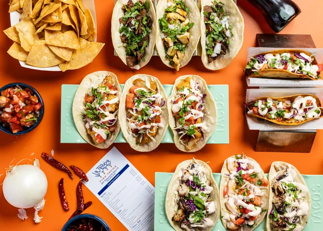 Fish tacos gridded on bright orange for La Taquiza, Napa