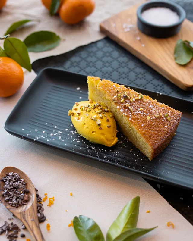 Cornbread and saffron gelato on black slate, matched to the set - recipe photography by Lemonad Media