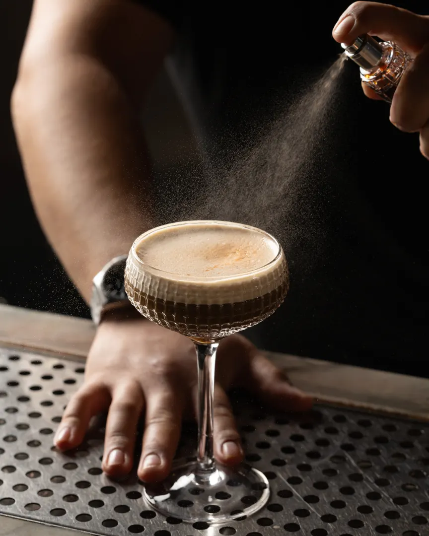 An espresso martini dusted mid-motion at Sons of Liberty Alehouse, San Leandro