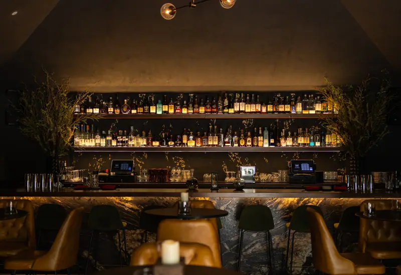 The back bar glowing at Suspiro speakeasy, Santana Row, San Jose, the restaurant photography portfolio
