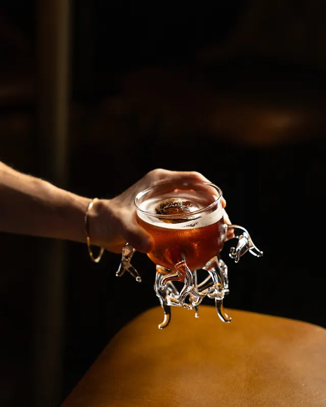 A smoked cocktail served in a glass bull at Suspiro, San Jose