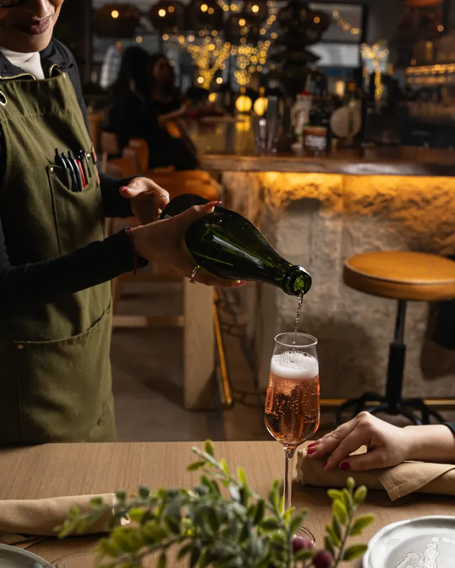 Sparkling poured at the stone bar at Suspiro, San Jose