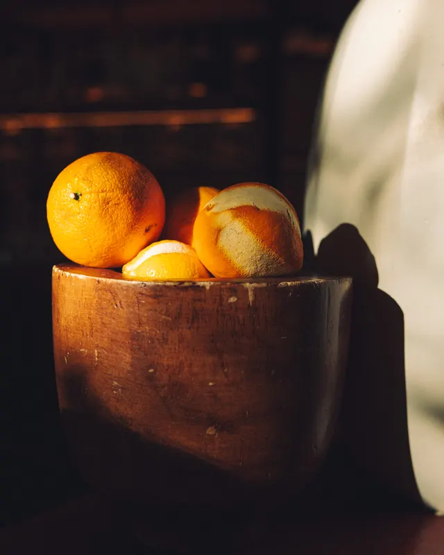 Oranges on the carved pedestal at Suspiro, San Jose