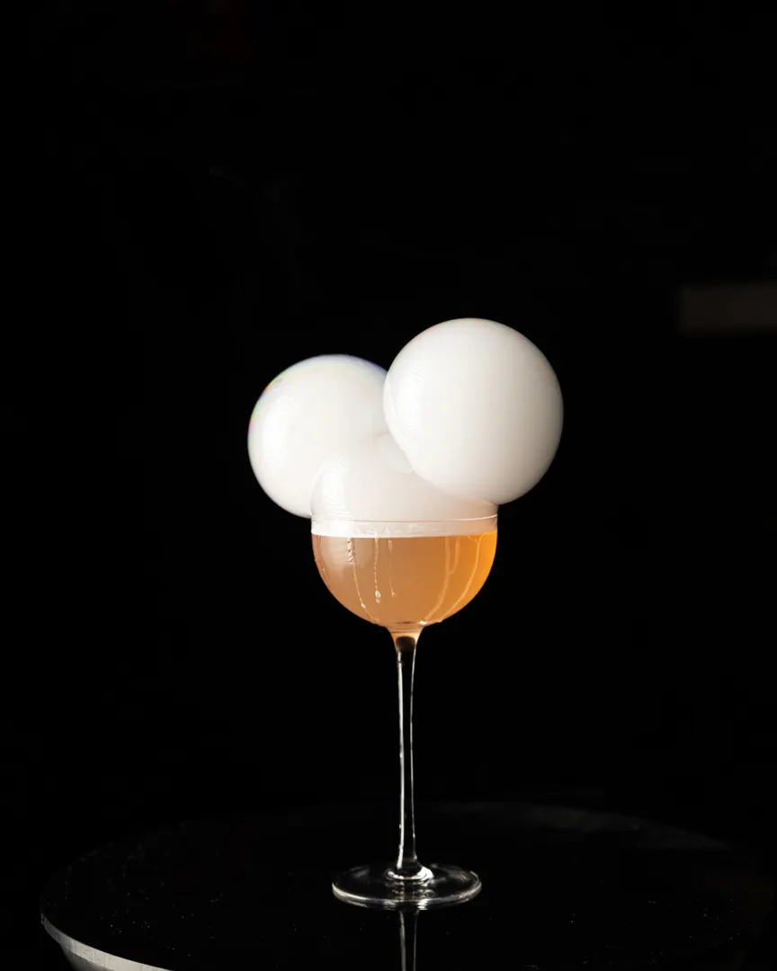 Smoke-filled bubbles stacked on a coupe at Suspiro, San Jose