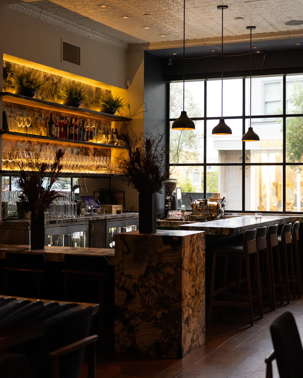 The marble bar in window light at Sorrel, San Francisco