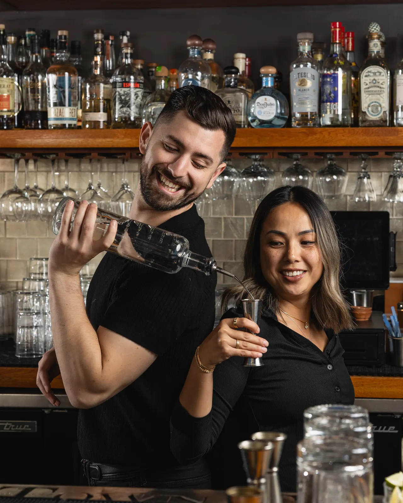 A high pour and a laugh behind the bar at Town Tavern, Alameda
