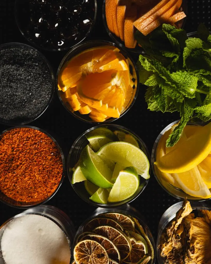 Garnish station from above: citrus, mint, and spices at Town Tavern, Alameda