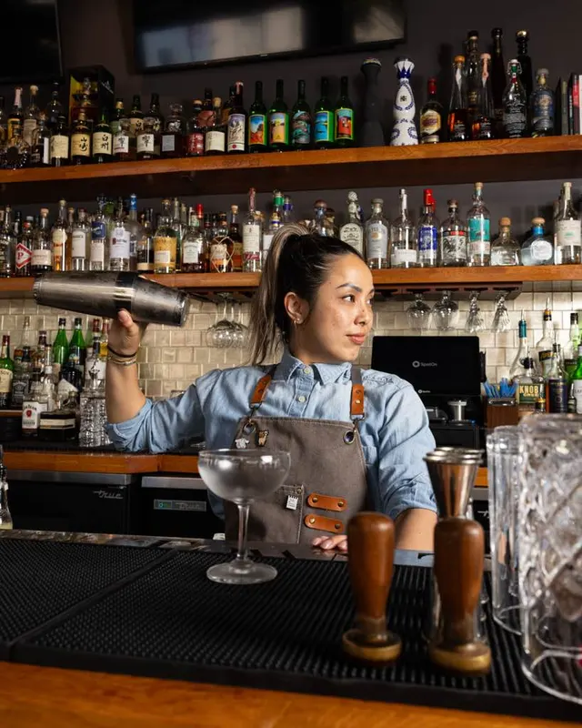 Mid-shake behind the bar at Town Tavern, Alameda